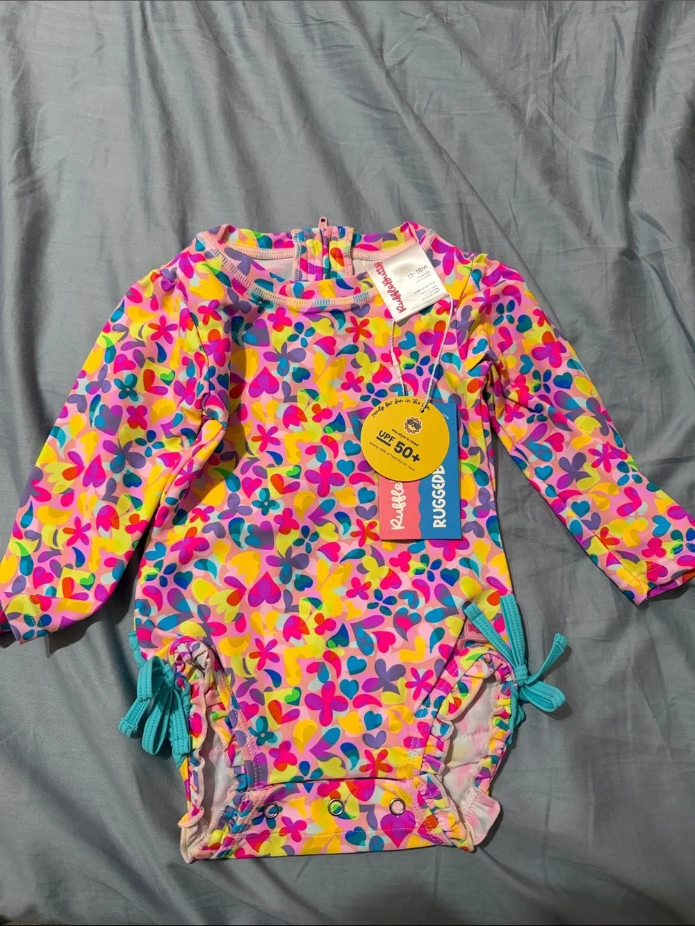 Ruffle Butts Neon Floral One-Piece Swimsuit in Pink, Yellow, Blue & Purple